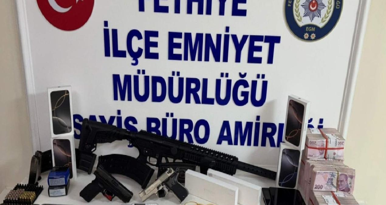 Dolandırıcılık şüphelisinin evinden cephanelik çıktı